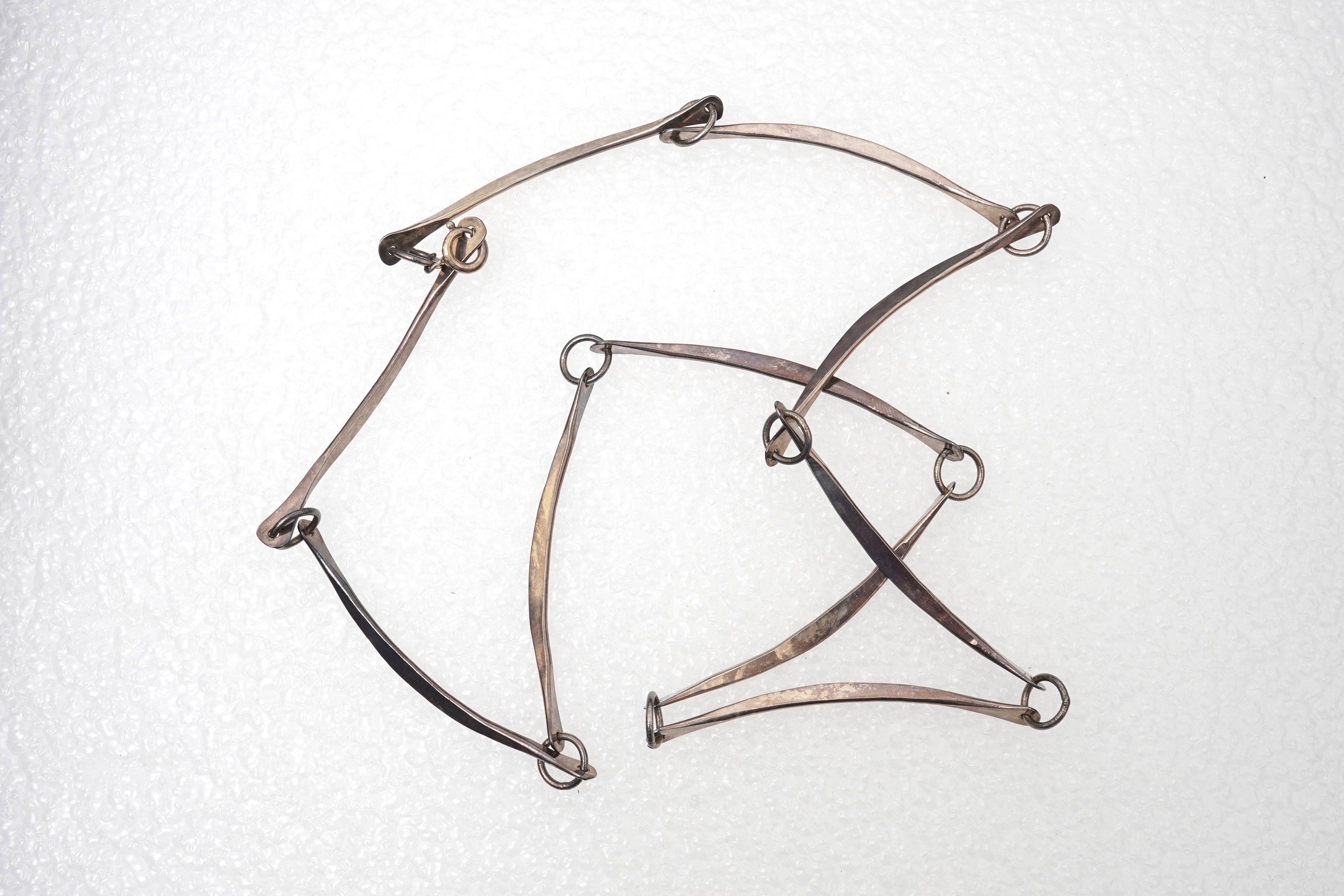 A 1960'sGeorg Jensen silver tie clip, design no. 63, 53mm, together with a stylish sterling necklace and two silver curb link bracelets.
